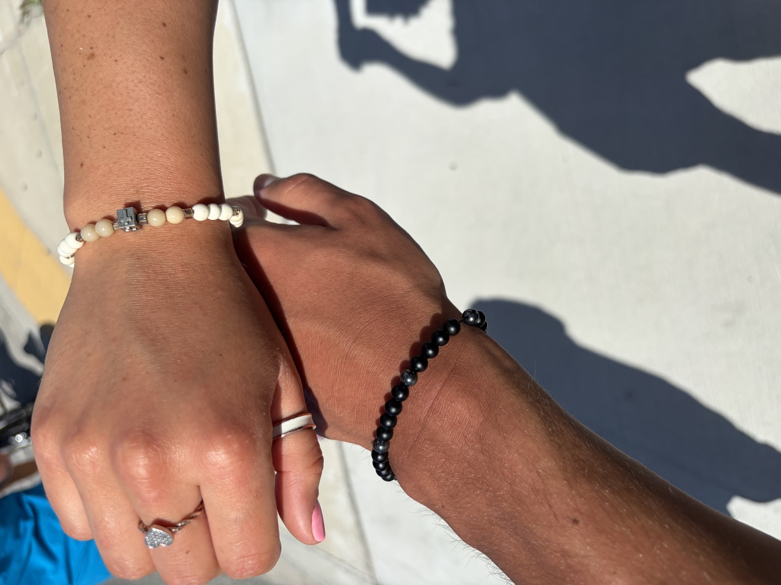 His-and-hers custom bracelets with cross detail