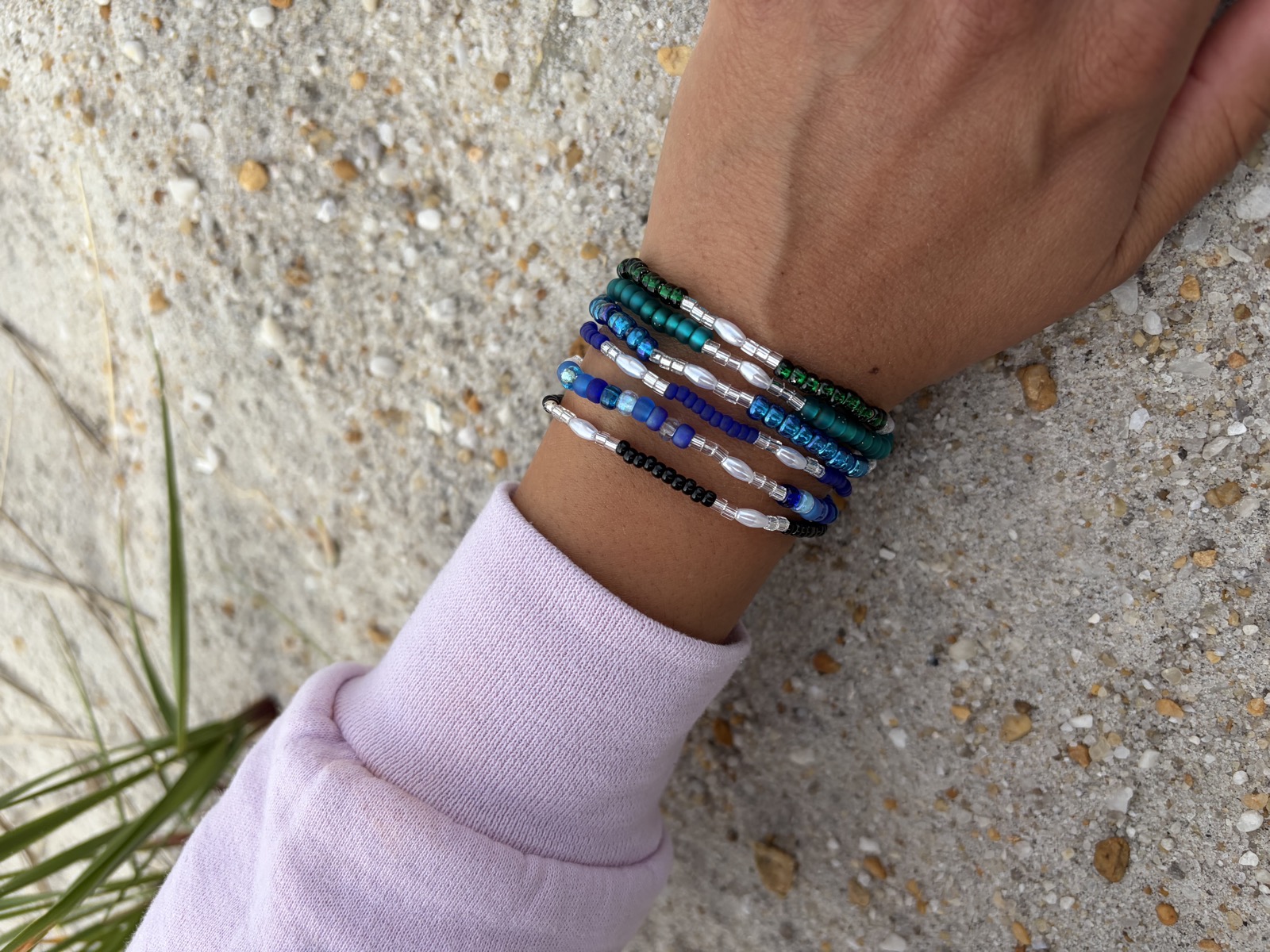 Blue and teal beaded stacked bracelets