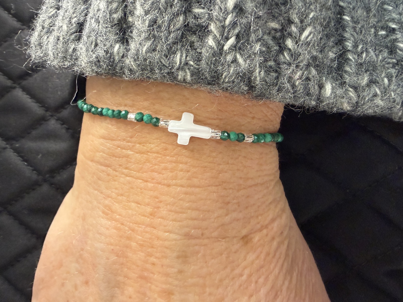 Green malachite bracelet with white cross bead
